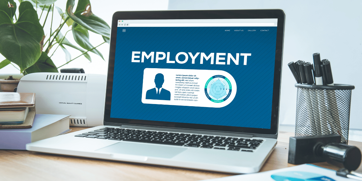 A laptop that says "Employment"